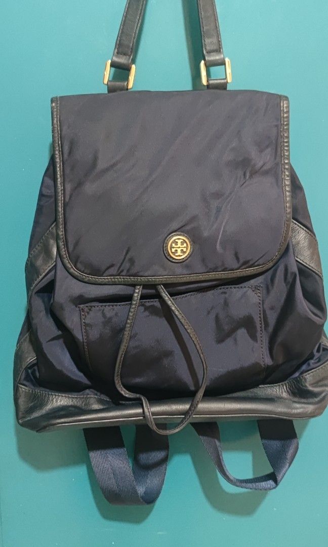 TB Backpack (Category: Luxury Bags & Wallets) located in Pagadian. Submitted by miccai143 (Listing ID 1335422380, Image 2). Description: Medium size Tory Burch nylon backpack with genuine leather material. rubber tag is intacked. No issue except it is not brand new hence it has slight signs of usage..