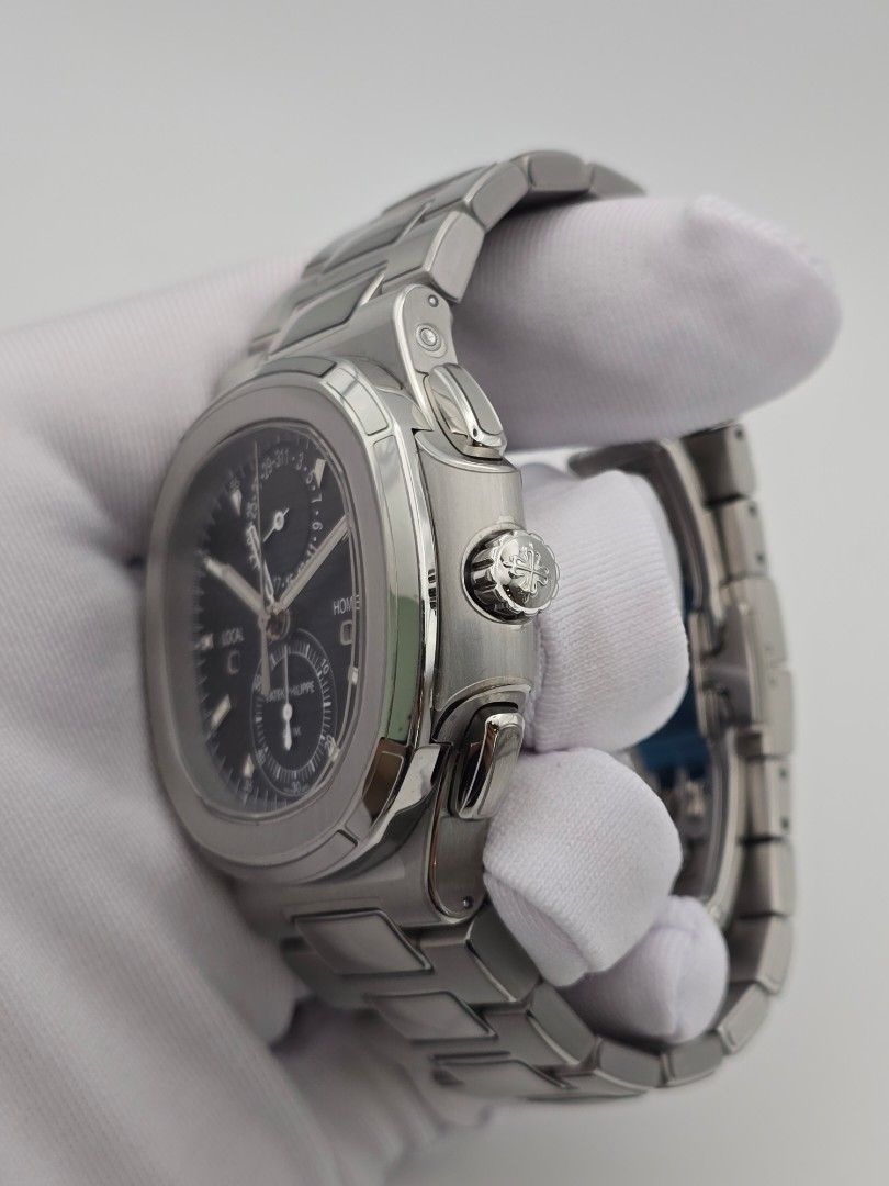 (WTT/WTS) Patek Philippe Nautilus Travel Time Chronograph 5990/1A-011 NOT Aquanaut 5711 5712 5980 5990 RM50 5968 5968 RM055 White Ceramic RM035 Red Nadal and Carbon RM72-01 RM30 RM11 (Category: Watches) located in Singapore. Submitted by alientime.sg (Listing ID 1335583446, Image 2). Description: The blue dial stands out as one of the most distinctive on the market, displaying varying hues under different lighting conditions—a true visual experie