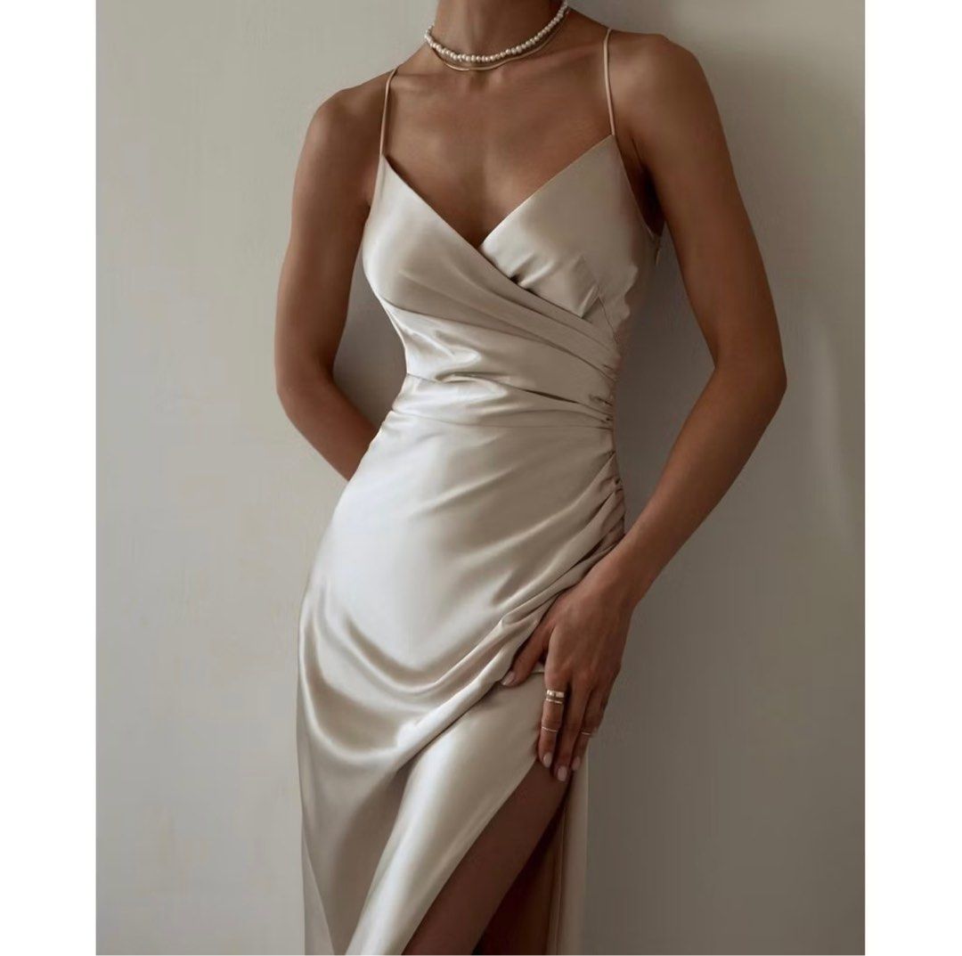 Champagne Satin Backless Slit Long Dress (Category: Dresses) located in Marikina City. Submitted by phoebecncpcn (Listing ID 1335677187, Image 2). Description: • High quality satin fabric (similar to Zara) • Only worn for fitting • Bought for P866 sa 🍊app • Got size XL but sizes run small (best suited for M-L frames) ‼️ See last slide for size guide RFS: Didn’t fit around the bust area.