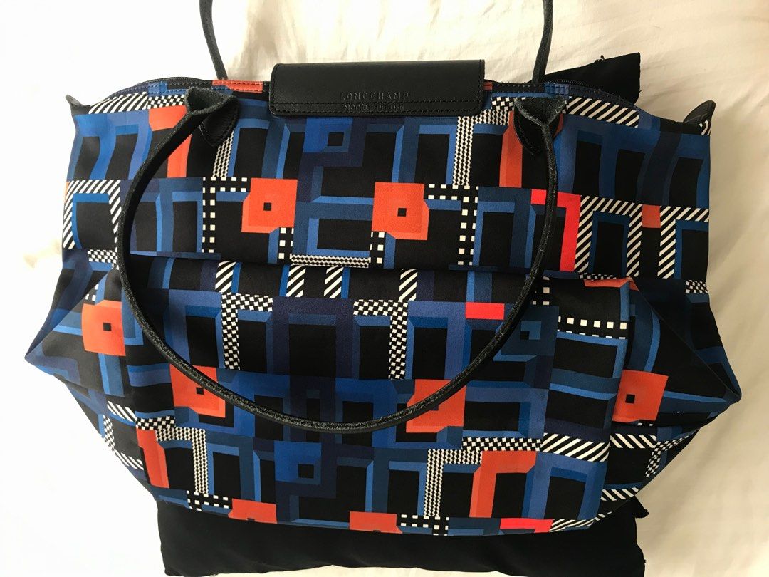 Prada Sling Bag & Longchamp Bag Large (Category: Luxury Bags & Wallets) located in Makati City. Submitted by laineycops (Listing ID 1335711278, Image 2). Description: Set ㅡ price for 2 Prada (KO) S-M Longchamp (AUTH) L (yellowing from storage) Lightly used Min. wear from storage DM for more pics for sure buyers only SOLD AS IS RFS: decluttering read 'about' on profile.