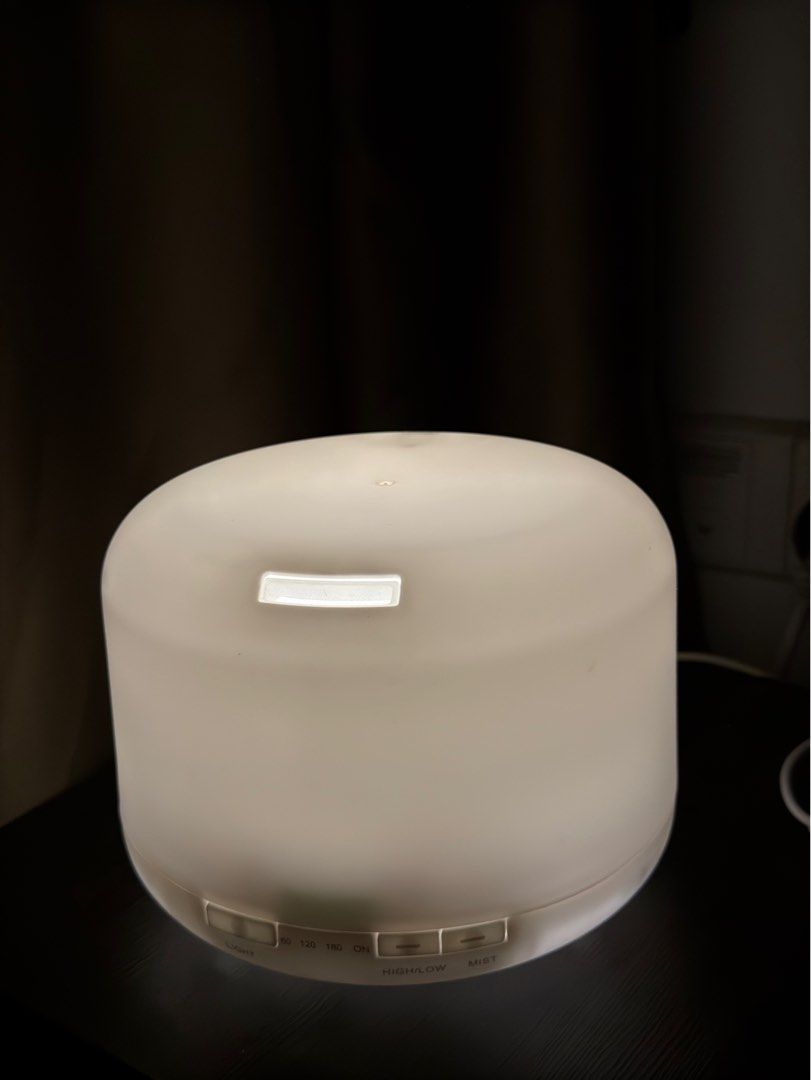 REDMOL Table Lamp / Diffusers (Category: Lighting) located in Singapore. Submitted by iamgroot_17 (Listing ID 1335748662, Image 3). Description: ⚠️ Diffuser mist function not working anymore ✨ 2 selection of the light (Soft & Strong) I’ve been using it as a TABLE LAMP for awhiles and it can perfectly be a table lamp that provides a very comfortable warm light for your room. Since I will be moving house soon, so I am thinking to let it go in a ver