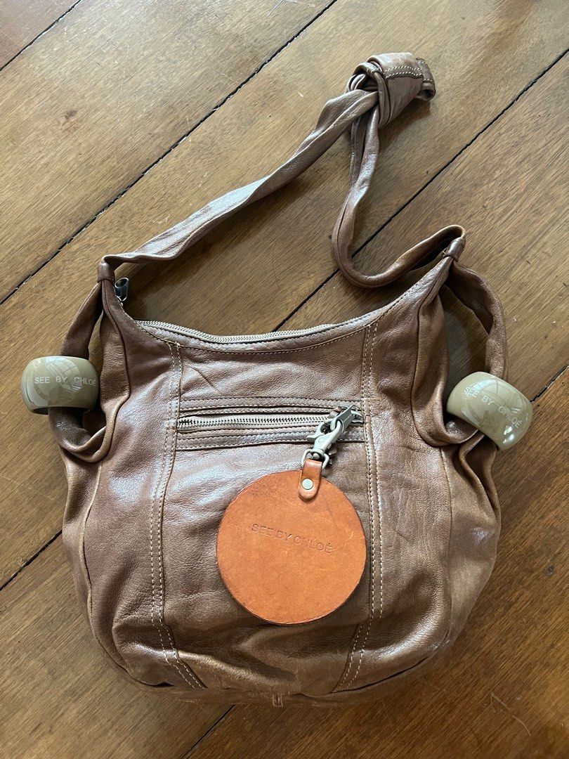 SEE by CHLOE Leather Sling Bag (Category: Luxury Bags & Wallets) located in Muntinlupa City. Submitted by bff_findsph (Listing ID 1335638289, Image 2). Description: Leather Sling Bag No issue No inclusions 100% Authentic Meduim size.