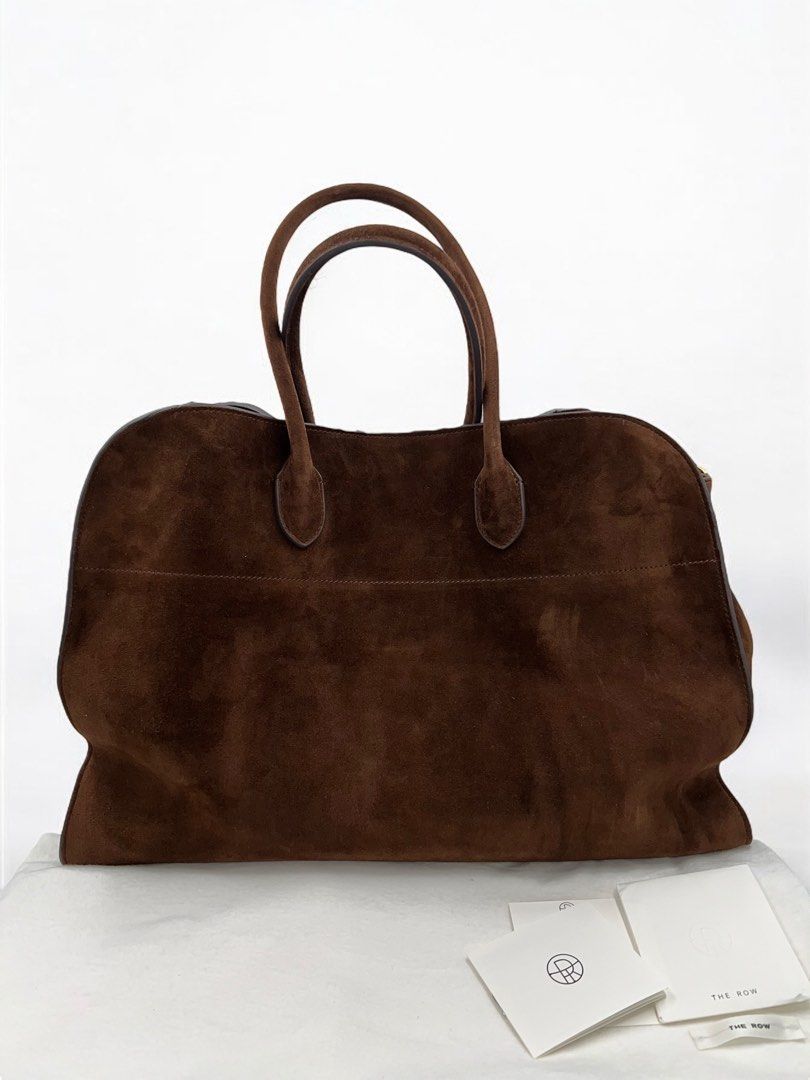 ⚜️The Row 17 - Mocha Suede bag (Category: Luxury Bags & Wallets) located in Makati City. Submitted by 90sangel (Listing ID 1335765042, Image 1). Description: •Item: The Row 17 - Mocha Suede bag 👜🤎 Your new Birkin... 📈👜 hard to get & find •Size: 17 Large & big •Condition: Brand New Condition *Softly structured top-handle bag in soft suede with belted gusseted side panels and interior toggle closure.👜⚜️ Guaranteed Auhentic- Negotiable..