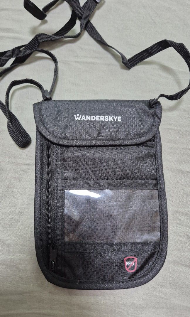 Wanderskye RFID Neck Wallet Accessories (Category: Luxury Bags & Wallets) located in Balagtas. Submitted by GoFundMyTravels (Listing ID 1335764271, Image 1). Description: Wanderskye RFID Neck Wallet Accessories color: black condition: used once RFS decluttering Anti-theft bag to carry items such as cash, cards, and passport. - Provided with RFID-blocking material to keep your information secured. - Perfect for lightweight and worry-free travel. -