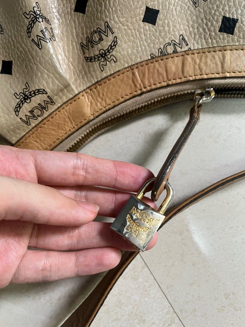 Authentic MCM Hobo Beige Visetos Leather Canvass Bag (Category: Luxury Bags & Wallets) located in Quezon City. Submitted by bebegaze (Listing ID 1335849955, Image 3). Description: Authentic With lock but no key One zipper puller missing With signs of use since preloved item like scratches, rubs, dirt etc. Please check all pics. .