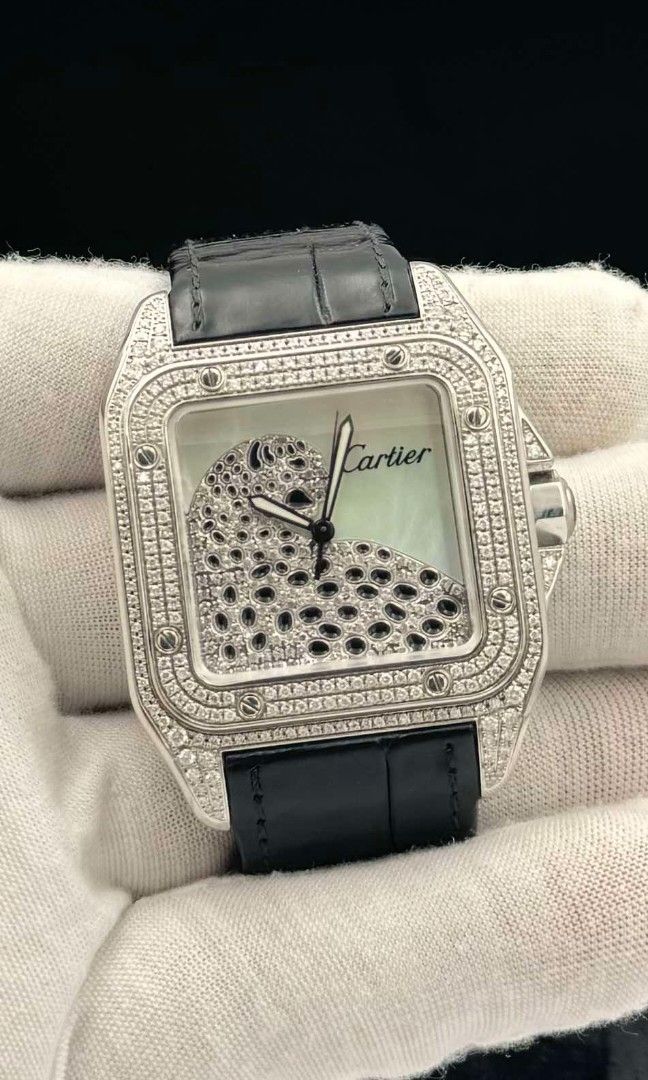 Cartier Santos (Category: Luxury Watches) located in Las Pinas. Submitted by calmphoenix.234114 (Listing ID 1335966245, Image 2). Description: CARTIER SANTOS 100 XL 38MM x 41.3MM REFERENCE 3774 MOTHER OF PEARL (MOP), PANTHÈRE DIAMOND DIAL DIAMOND BEZEL CARTIER BLACK LEATHER STRAP CONDITION 9.8 INCLUSIONS: CARTIER BOX.