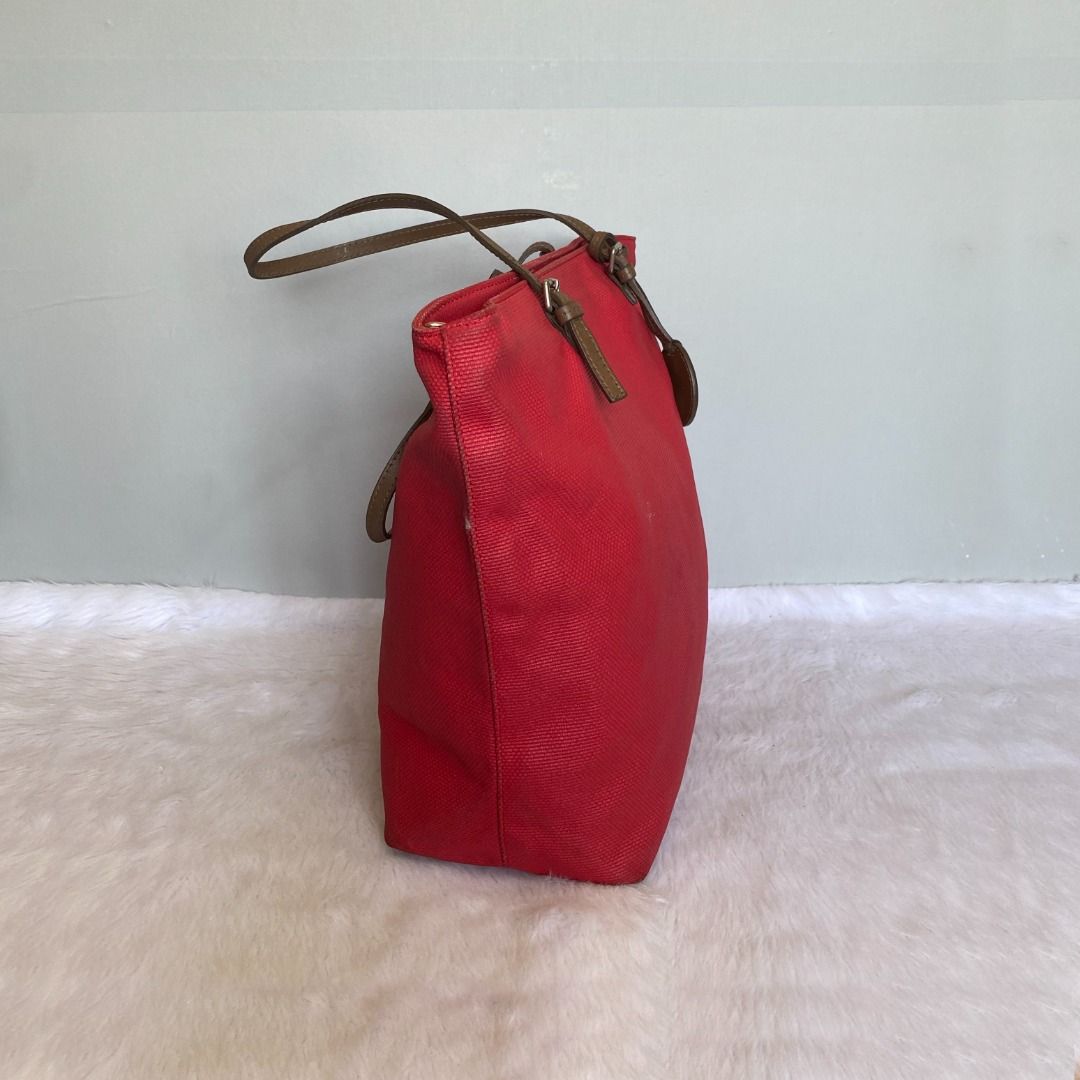 Furla Red Canvas Shoulder Tote Bag (Category: Tote Bags) located in Mandaue City. Submitted by great.style.shoppe (Listing ID 1335823562, Image 2). Description: Crafted in canvas and genuine leather. Made in Italy. In very good condition showing normal signs of wear. 100% AUTHENTIC or your money back!!! Length: 16 inches; Height: 12 inches; Depth: 5 inches; Handle drop: 9 inches. .
