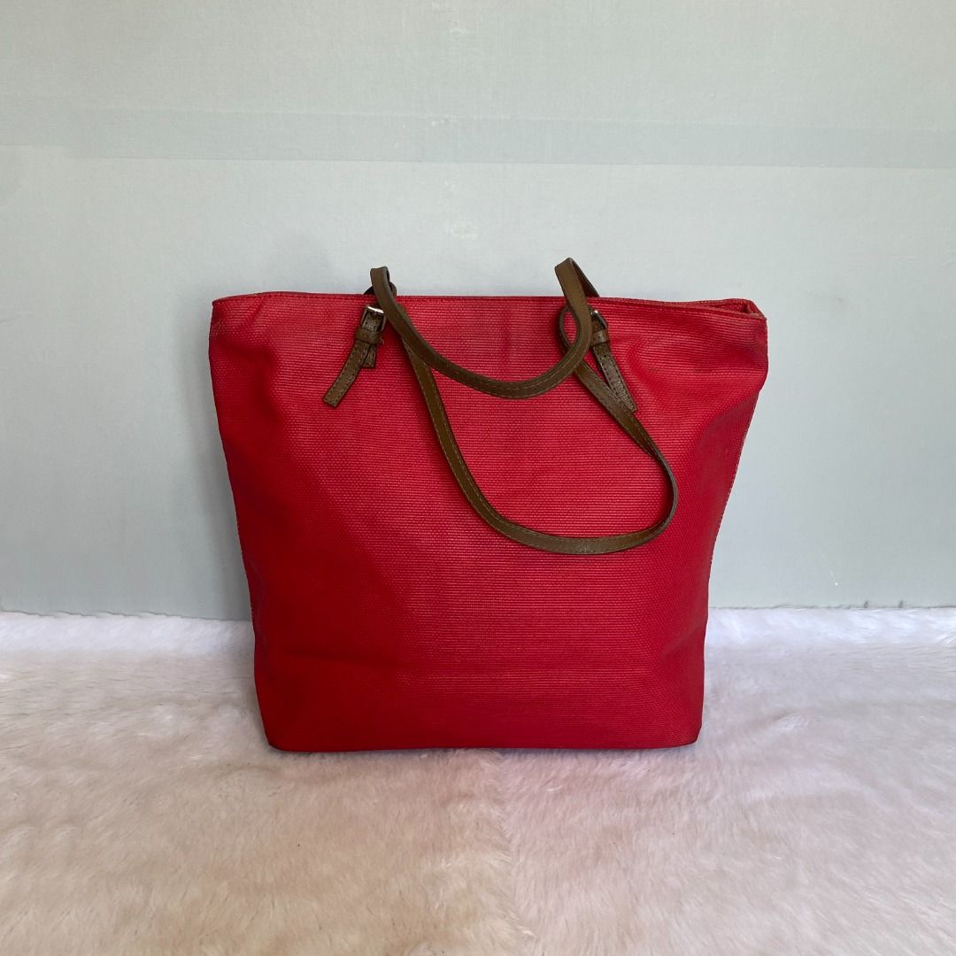 Furla Red Canvas Shoulder Tote Bag (Category: Tote Bags) located in Mandaue City. Submitted by great.style.shoppe (Listing ID 1335823562, Image 3). Description: Crafted in canvas and genuine leather. Made in Italy. In very good condition showing normal signs of wear. 100% AUTHENTIC or your money back!!! Length: 16 inches; Height: 12 inches; Depth: 5 inches; Handle drop: 9 inches. .