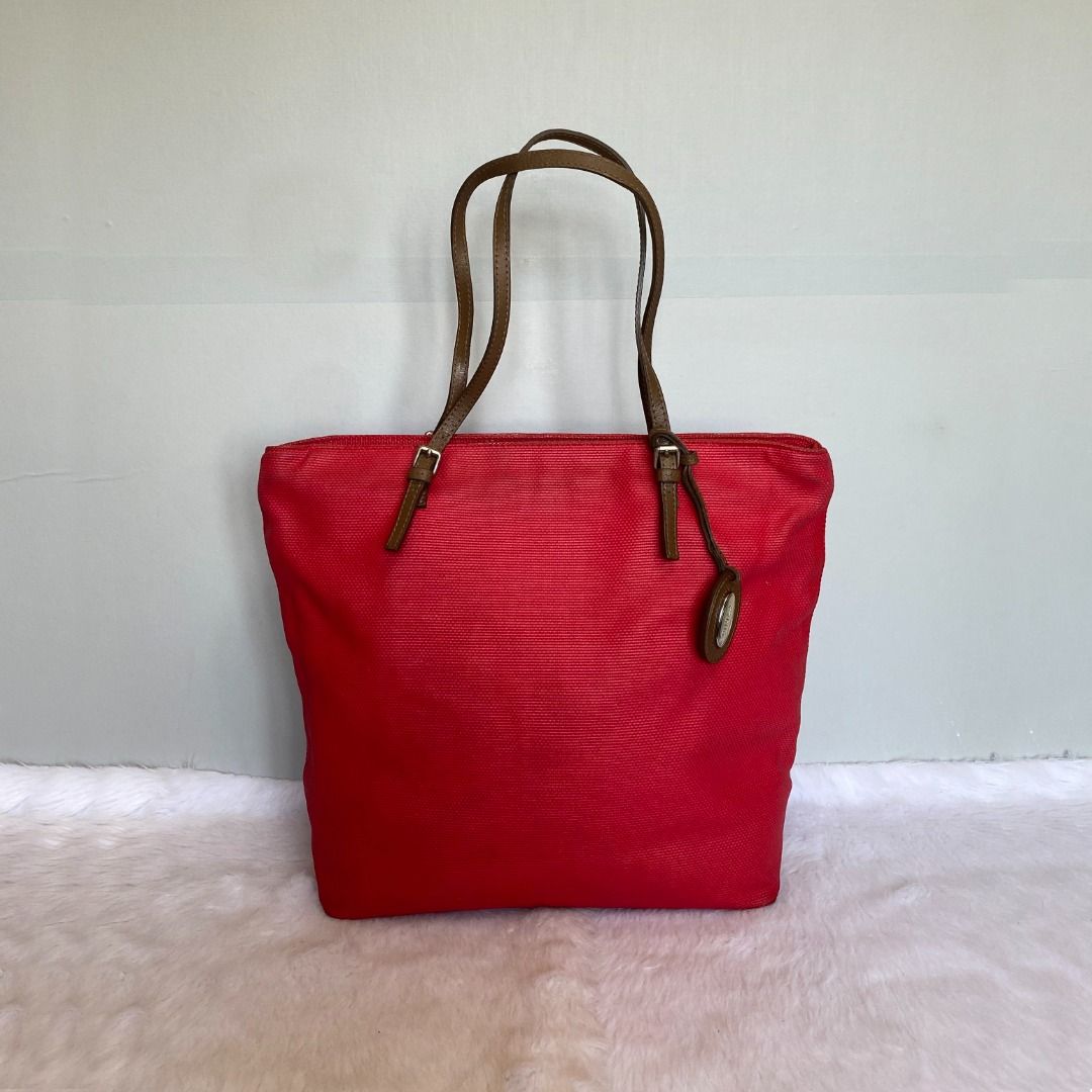 Furla Red Canvas Shoulder Tote Bag (Category: Tote Bags) located in Mandaue City. Submitted by great.style.shoppe (Listing ID 1335823562, Image 1). Description: Crafted in canvas and genuine leather. Made in Italy. In very good condition showing normal signs of wear. 100% AUTHENTIC or your money back!!! Length: 16 inches; Height: 12 inches; Depth: 5 inches; Handle drop: 9 inches. .