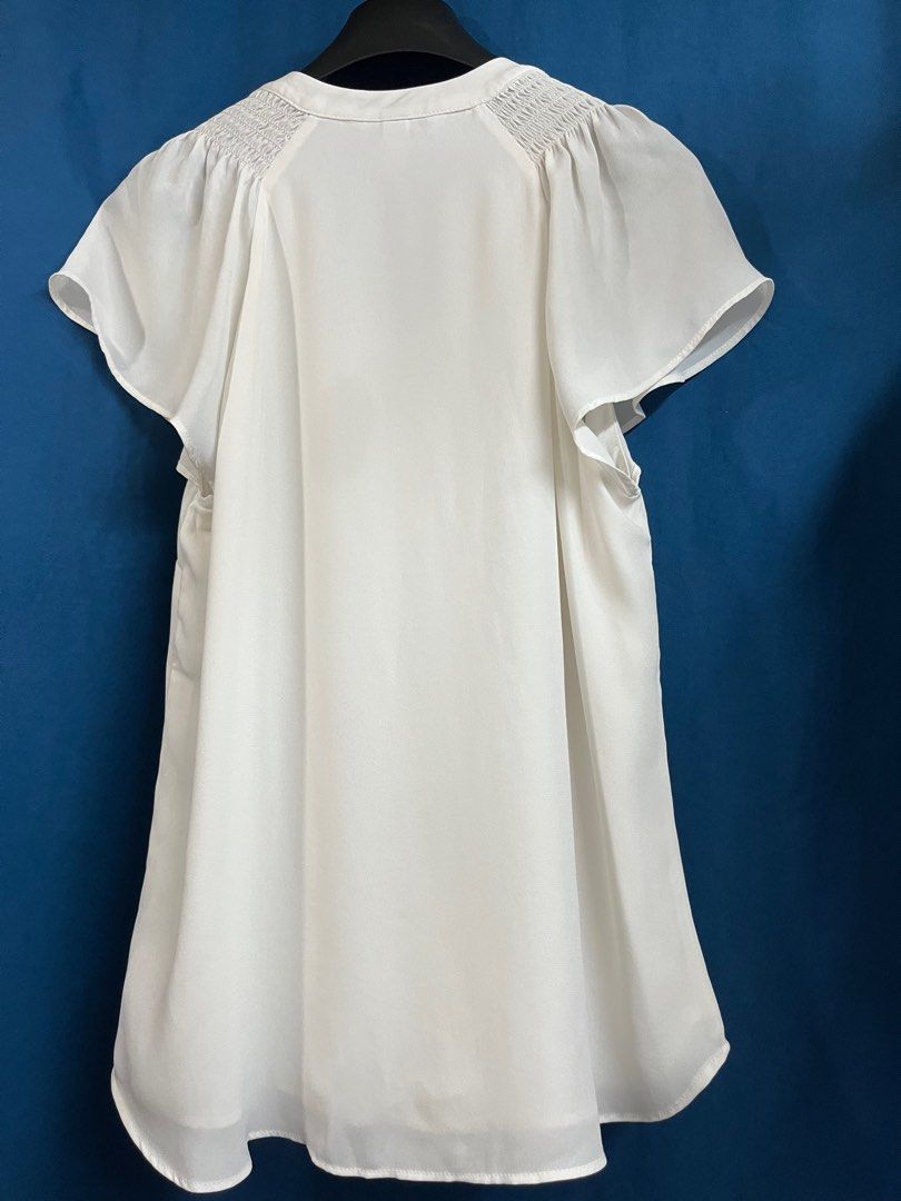 H&M Ivory White Buttondown Flutter Sleeves Top (Category: Blouses) located in Quezon City. Submitted by wednesday21 (Listing ID 1335858213, Image 2). Description: H&M ivory white flutter sleeve top. V-neck and button-down front. With short flutter sleeves and slight gathered/ruching detail at the shoulders. Semi-sheer and lightweight fabric. Relaxed fit. Size S. 3-day reservation only. Once offer is accepted, payment is expected to be made within