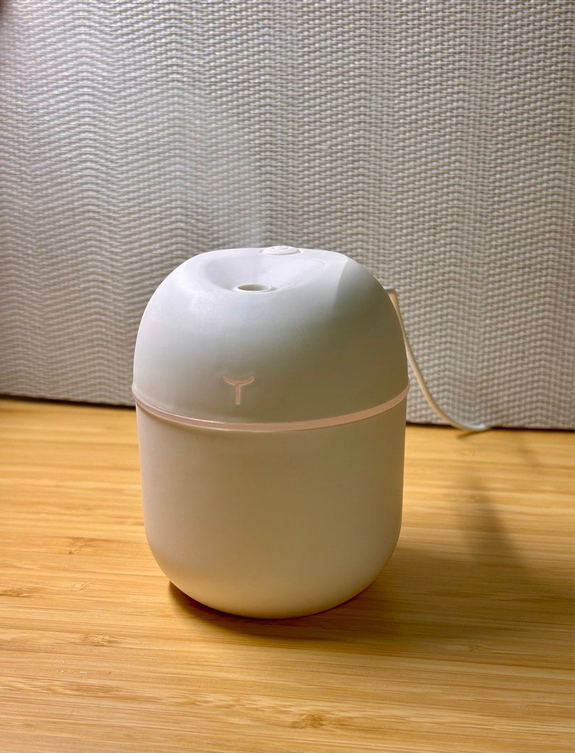 Mist Diffuser (Category: Air Purifiers & Dehumidifiers) located in Singapore. Submitted by ilikeemoney (Listing ID 1335953578, Image 3). Description: Portable 220ml desktop humidifier Charging cable: Mini USB Colours: White, Pink READ BEFORE PURCHASE: The manufacturer and distributor are not liable for any damages, injuries, or losses resulting from misuse, improper installation, or maintenance of this product. By using this product, you assume a