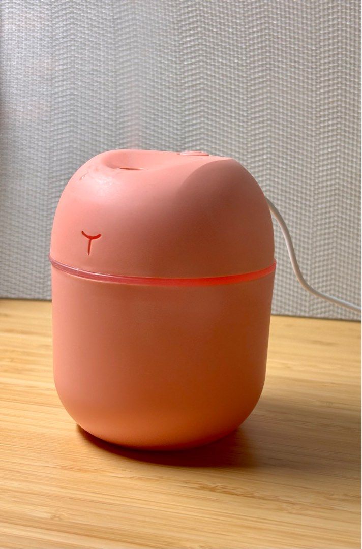Mist Diffuser (Category: Air Purifiers & Dehumidifiers) located in Singapore. Submitted by ilikeemoney (Listing ID 1335953578, Image 5). Description: Portable 220ml desktop humidifier Charging cable: Mini USB Colours: White, Pink READ BEFORE PURCHASE: The manufacturer and distributor are not liable for any damages, injuries, or losses resulting from misuse, improper installation, or maintenance of this product. By using this product, you assume a