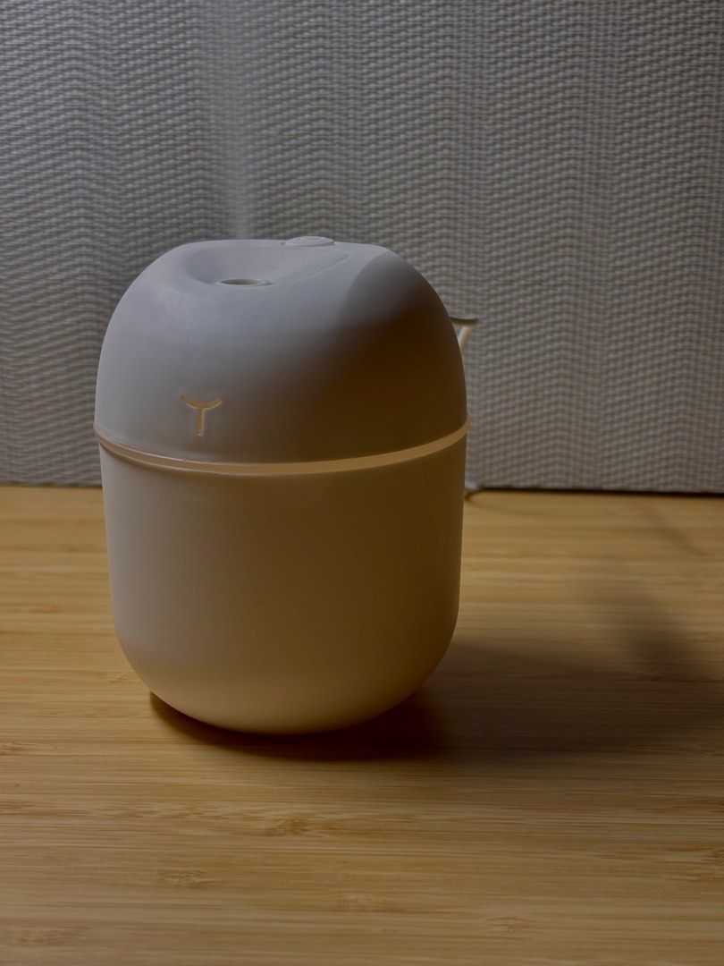 Mist Diffuser (Category: Air Purifiers & Dehumidifiers) located in Singapore. Submitted by ilikeemoney (Listing ID 1335953578, Image 4). Description: Portable 220ml desktop humidifier Charging cable: Mini USB Colours: White, Pink READ BEFORE PURCHASE: The manufacturer and distributor are not liable for any damages, injuries, or losses resulting from misuse, improper installation, or maintenance of this product. By using this product, you assume a
