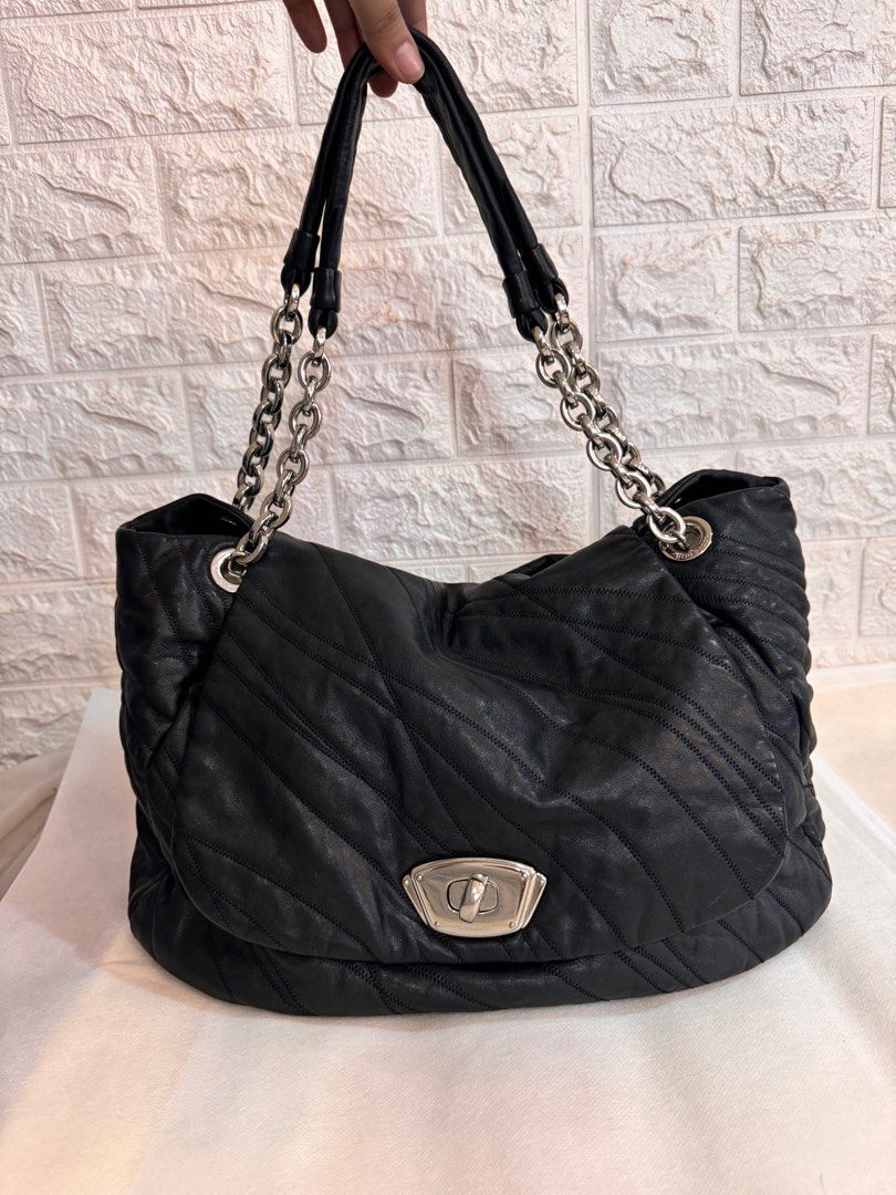 NINA RICCI Shoulder Leather Bag (Category: Luxury Bags & Wallets) located in Davao. Submitted by stellietas (Listing ID 1335937944, Image 1). Description: No flaws, excellent condition, looks new. Size: 16.5L X 11.5H x 5W inches Minimal scratches on the lock hardware, metal plate. Silver hardware Black Clean interior. Genuine leather, makapal and slightly may weight..