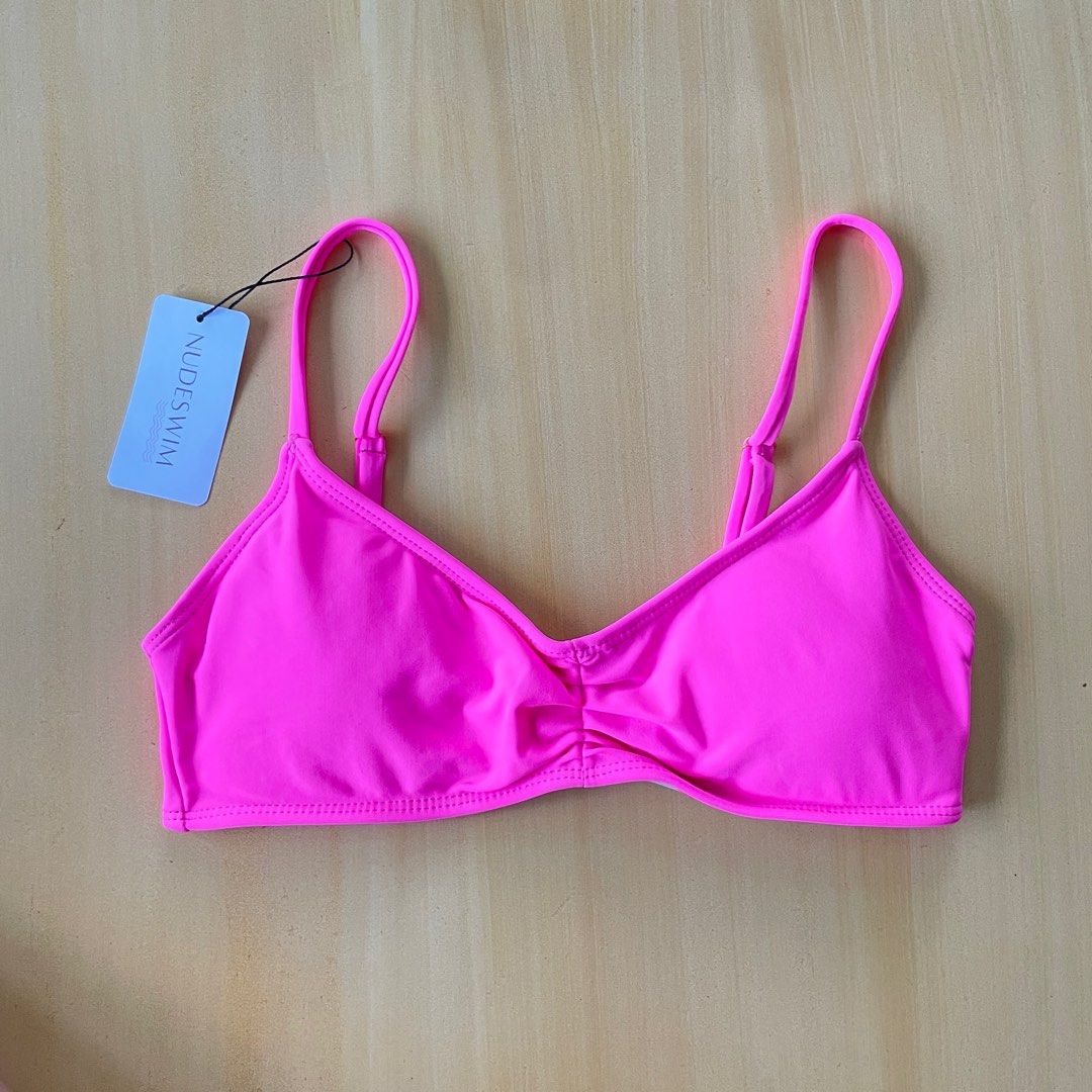 NUDESWIM Pink Swimsuit Top (Category: Bikinis & Swimsuits) located in Orion. Submitted by alyssamint (Listing ID 1335865151, Image 1). Description: NUDESWIM Swimsuit Top Color Pink With adjustable straps Size S Brand New With Tag.