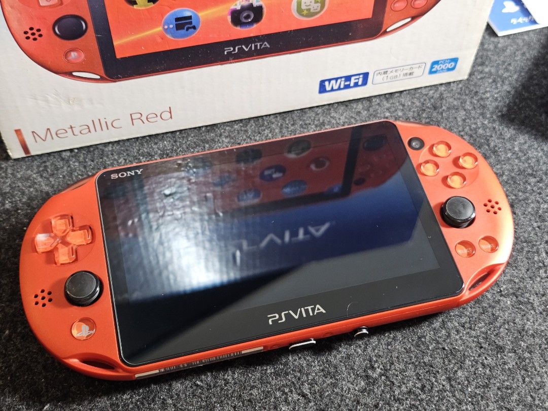 PS Vita Slim Metallic Red (Rare) (Category: PlayStation) located in Paranaque City. Submitted by john020497 (Listing ID 1335821685, Image 2). Description: - Complete with box, manuals, ar cards, charging brick and charging cord. - Around 9.5/10 percent smoothness over all. Screen protected front and back. - With 128gb sd2vita. Parañaque area. Delivery via Lalamove/Grab/LBC..