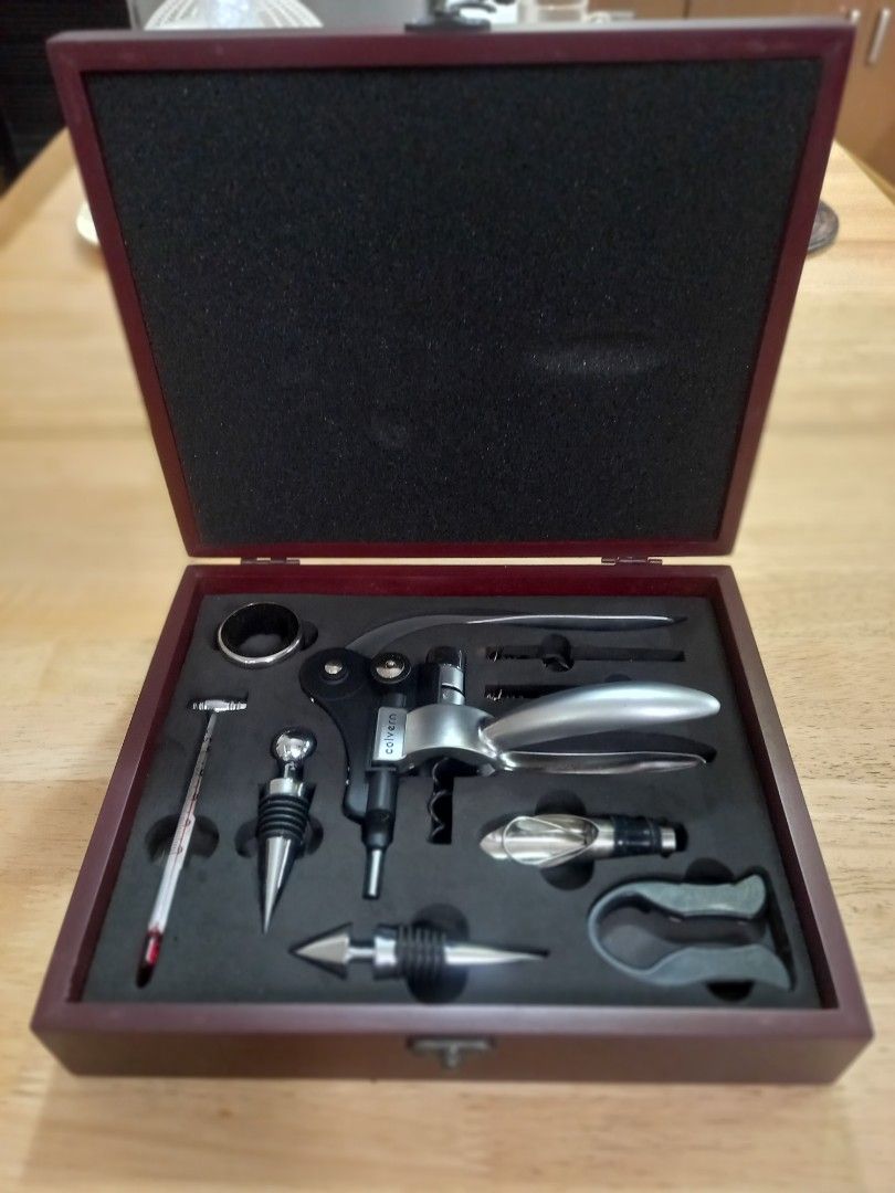 Wine - Corkscrew Set - Colvern Saphire Corkscrew Set (Category: Wine Cellar & Storage) located in Binan City. Submitted by graziosomoderato (Listing ID 1336044967, Image 1). Description: Corkscrew zinc alloy 2 wine stoppers - zinc alloy with rubber rings Wine thermometer made of glass with zinc alloy Pourer with stopper - stainless steel with silicone black part 2 spare corkscrews - made of metal teflon coating Foil cutter - made of plastic with 