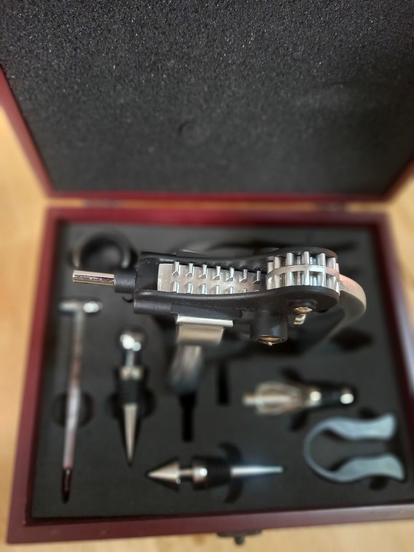Wine - Corkscrew Set - Colvern Saphire Corkscrew Set (Category: Wine Cellar & Storage) located in Binan City. Submitted by graziosomoderato (Listing ID 1336044967, Image 2). Description: Corkscrew zinc alloy 2 wine stoppers - zinc alloy with rubber rings Wine thermometer made of glass with zinc alloy Pourer with stopper - stainless steel with silicone black part 2 spare corkscrews - made of metal teflon coating Foil cutter - made of plastic with 