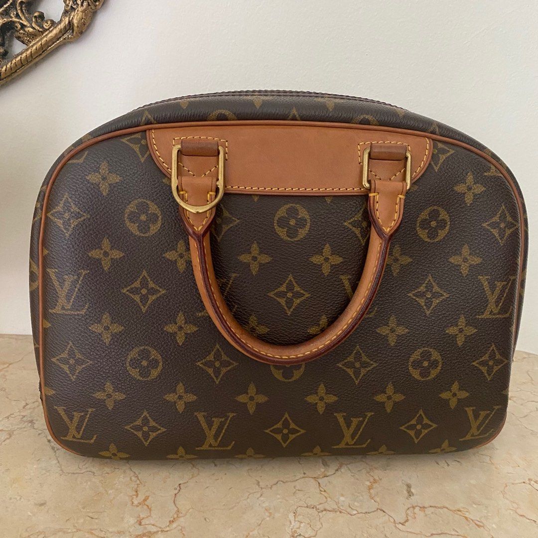 Louis Vuitton Deauville Monogram Bag (Category: Bags & Wallets) located in Singapore. Submitted by mis0x (Listing ID 1336075417, Image 2). Description: Authentic. Comes with original dust bag. Please note the condition is reflected as in pictures, item is in preloved condition, generally in ok condition, but with some light staining and discoloration as shown. Please ask questions to clarify before purchasing..