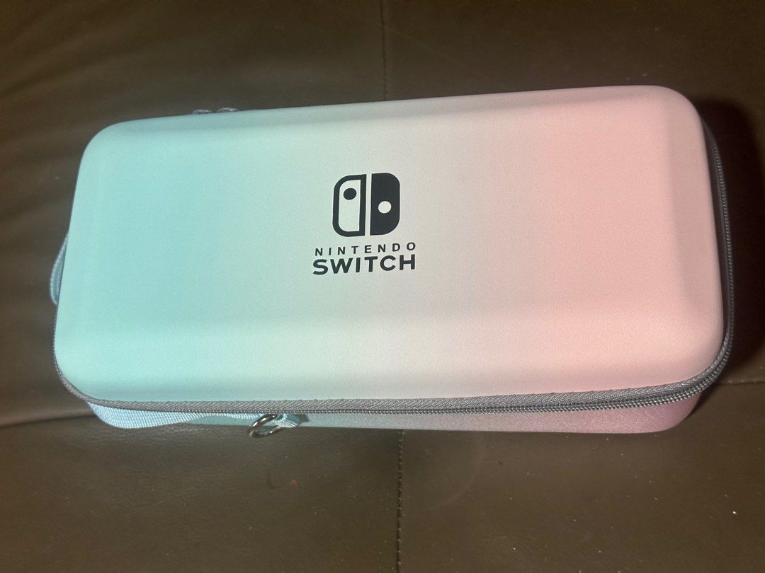 Nintendo Switch Console Casing (Category: Cases & Covers) located in Singapore. Submitted by absolutely12758 (Listing ID 1336042455, Image 1). Description: Nintendo Switch Console Casing! The casing is able to hold the following items: Docking Game console Joycons Charger Game Cartridges .