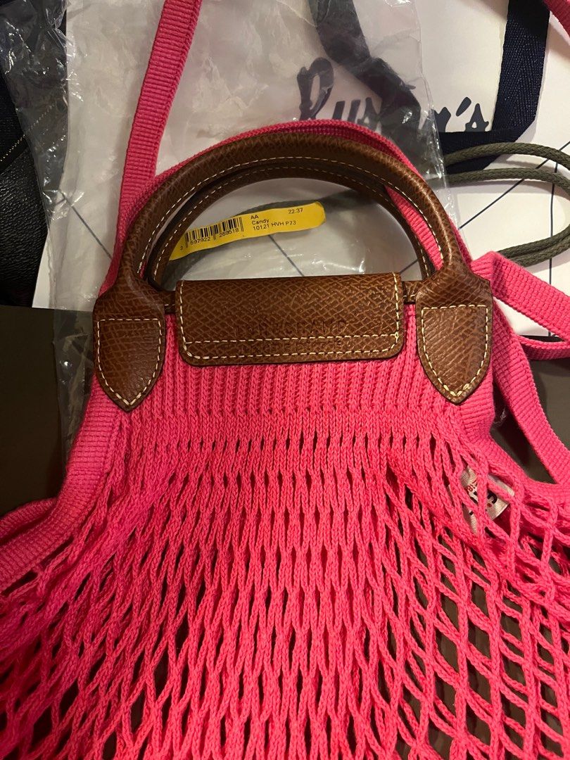 Original Longchamp Le Pliage Filet Top Handle Bag (Category: Luxury Bags & Wallets) located in Makati City. Submitted by mintbags (Listing ID 1336097343, Image 3). Description: Original Longchamp Le Pliage Filet Top Handle Bag Candy Complete inclusions (see photos) Bought from Rustan’s Makati .