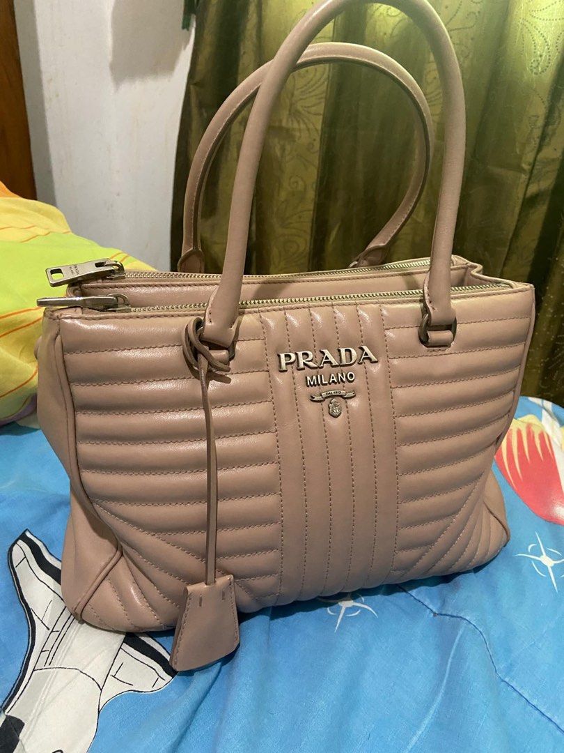 Prada double zip tote diagramme bag (Category: Luxury Bags & Wallets) located in Manila. Submitted by araackerman (Listing ID 1336103569, Image 2). Description: Original Price: 98,000 Mode of payment: Gcash, Cash, Seabank, Maya Location: Batangas and Manila If location is too far, I can ship the product to you. Shipping fee is already included. STRICTLY, NO RETURN AND REFUND! PM me for inquiries ♥️.
