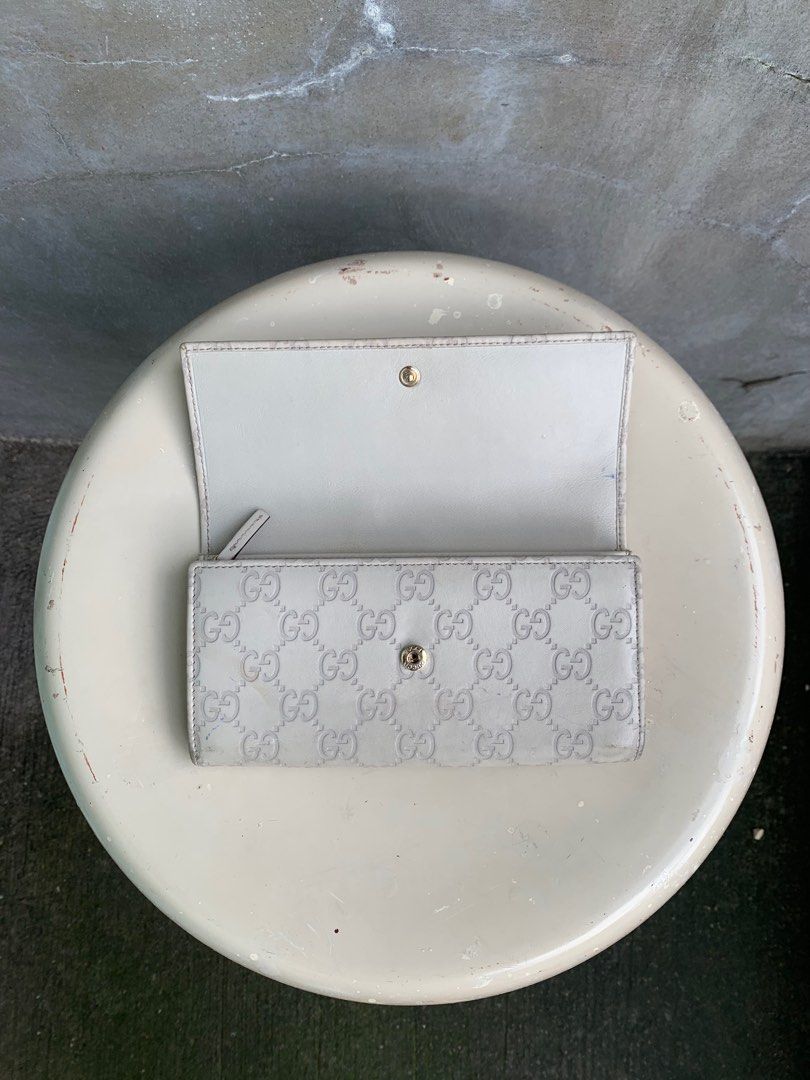 Gucci Guccissima Long Wallet (Category: Luxury Bags & Wallets) located in Baguio. Submitted by lordeidara (Listing ID 1336240220, Image 2). Description: Rank C Needs deep cleaning Stained Paint chip offs on hardware Color:Cream Material:,Leather Size on tag: Length:7.75 Width:1.5 Height:4.5 Strap Length: Number of Pockets:10.