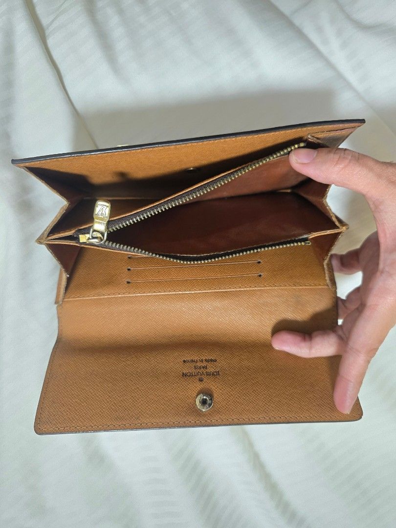 Louis Vuitton Sarah Wallet Monogram (Category: Luxury Bags & Wallets) located in Quezon City. Submitted by mademoisellegirl (Listing ID 1336248348, Image 3). Description: Louis Vuitton Monogram Sarah Wallet Has minor defect on the pipping but cannot affect the use of the wallet Still in vibrant Monogram Canvass Has a lot of Card slots Perfect for everyday use..
