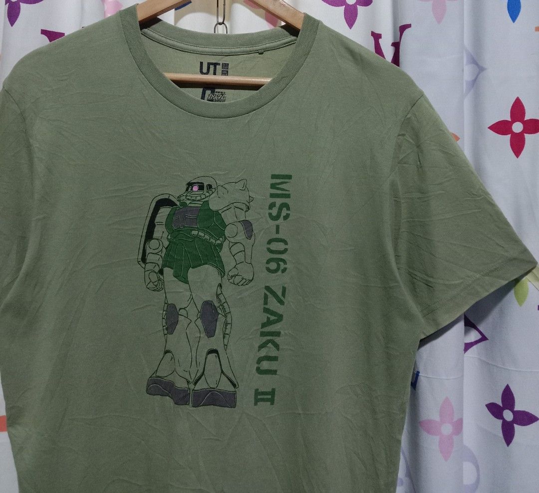 UNIQLO X GUNDAM (Category: Tshirts & Polo Shirts ) located in San Rafael. Submitted by temyongthriftv2 (Listing ID 1336314972, Image 2). Description: UNIQLO X GUNDAM Excellent condition, mabago Ganda ng kulay Laser print Large ( 21 x 28) May maliit na butas sa right sleeve.