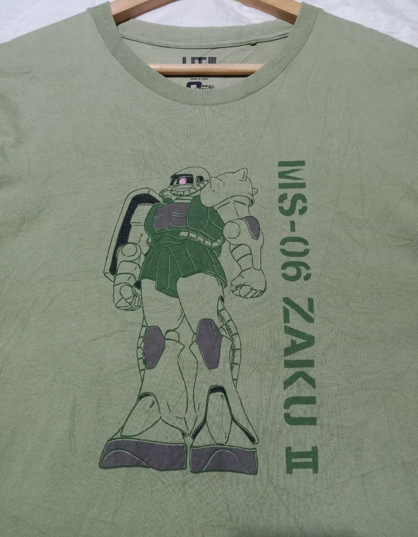 UNIQLO X GUNDAM (Category: Tshirts & Polo Shirts ) located in San Rafael. Submitted by temyongthriftv2 (Listing ID 1336314972, Image 3). Description: UNIQLO X GUNDAM Excellent condition, mabago Ganda ng kulay Laser print Large ( 21 x 28) May maliit na butas sa right sleeve.