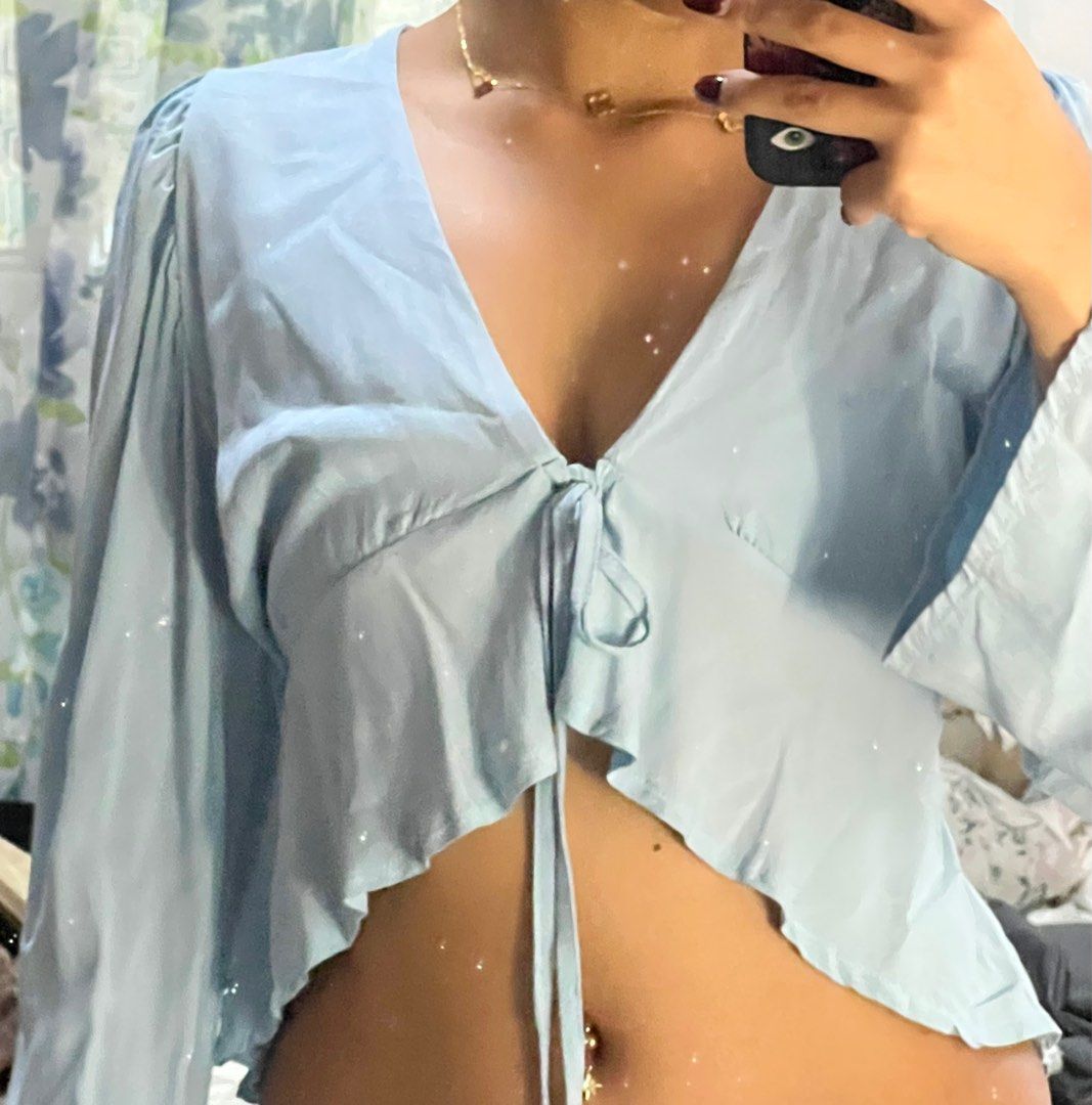 Blue Long Sleeve Tie Cropped Top (Category: Blouses) located in Paranaque City. Submitted by flamespicks (Listing ID 1336408269, Image 1). Description: Brand: None Size: S Condition: Lightly Used Fabric: Cotton Rfs: Too big on my bust Model's Measurements Bust: 33 Waist: 25 Hips: 35 .
