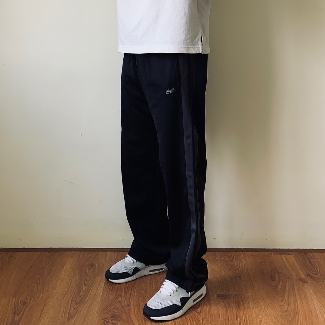 Nike black side tape track pants Men s Fashion Bottoms Joggers on Carousell