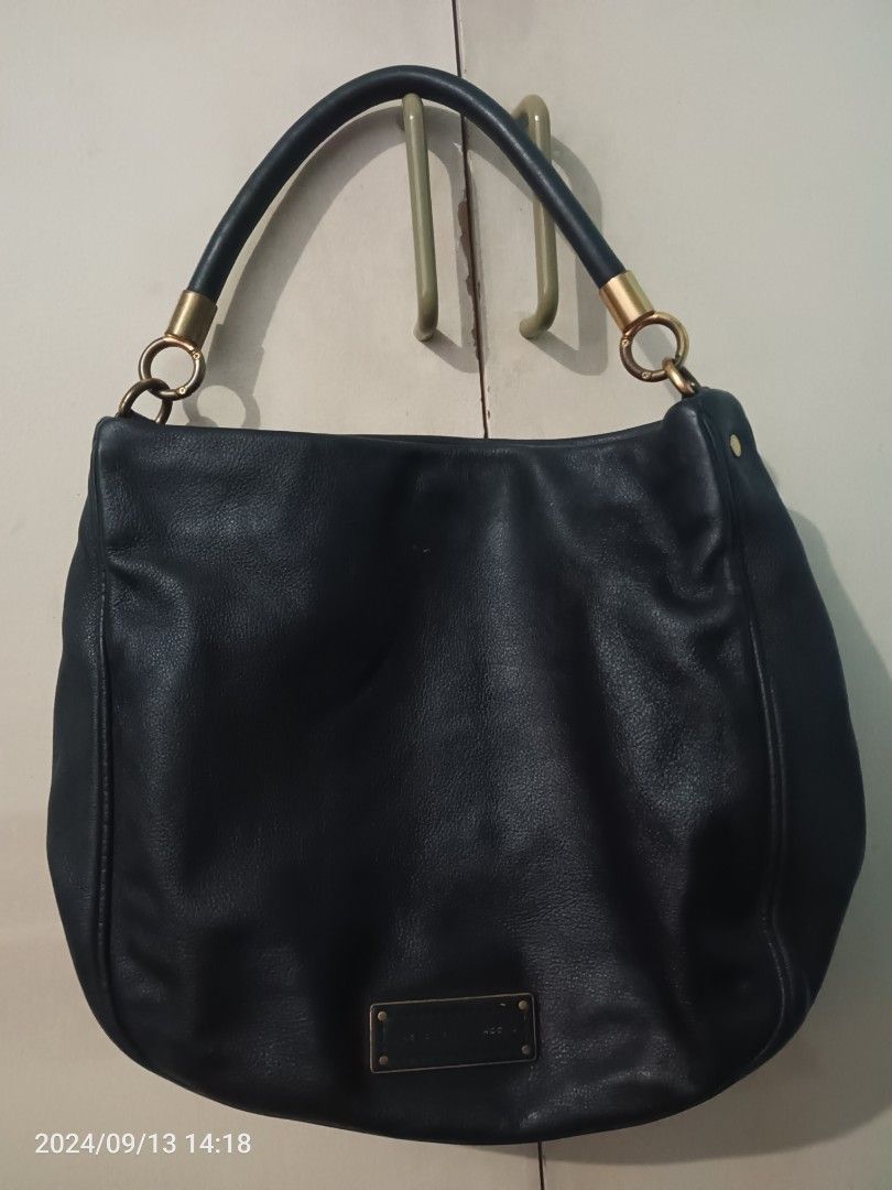 Original MJ hobo bag (Category: Luxury Bags & Wallets) located in Pasig City. Submitted by lfboutique (Listing ID 1336488711, Image 1). Description: original used medium size pls see photos for reference no sling strap, faded logo snap closure PLS wag makipag haggle tapos di Naman bibilhin Ang item!.