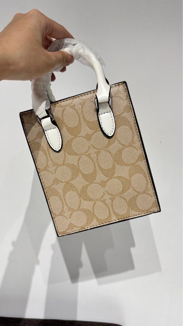 Coach North South Mini Tote Bag (Category: Luxury Bags & Wallets) located in Paranaque City. Submitted by preloved_rrr (Listing ID 1336647360, Image 2). Description: • With dust bag and box • Bangkok Version.