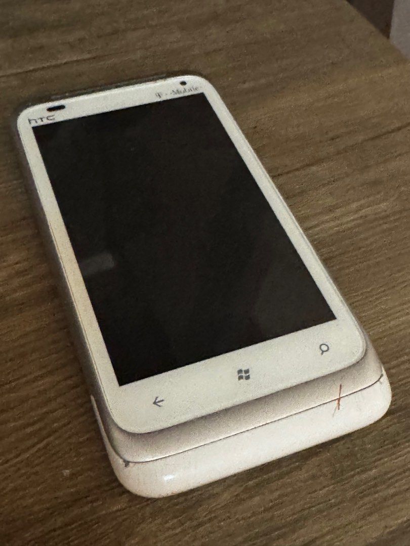 HTC Windows phone (Use for PROP/Display) (Category: Early Generation Mobile Phones) located in Manila. Submitted by natlan.mualani (Listing ID 1336605704, Image 1). Description: Honestly not really good for any other use case. Sim locked to T-MOBILE and can’t connect to computer. Too old for wifi. Still good for maybe camera, music, video. Works well for prop phone..