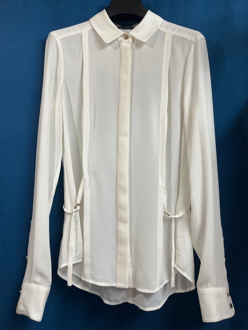 Karen Millen Cream Buttondown Collared Blouse (Category: Longsleeves) located in Quezon City. Submitted by wednesday21 (Listing ID 1336581302, Image 1). Description: Karen Millen cream buttondown collared longsleeve blouse, with concealed gold button placket and side-tie design with gold buckles. Gold button cuffs and foldable sleeves. Size XS on tag. Waist is 13in laid flat. 3-day reservation only. Once offer is accepted, payment is expected to 