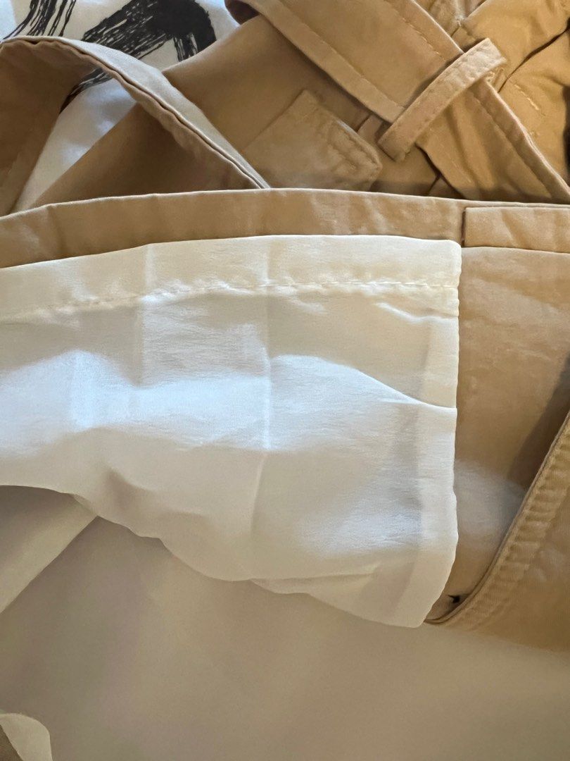 KHAKI BROWN MINI TRENCH SKIRT (Category: Skirts) located in Manila. Submitted by declutterluxe (Listing ID 1336555810, Image 3). Description: Worn twice only Fits S-M frames My waist is 26-27” and can still stretch due to elasticized back Length 15.5” Working buttons Removable waist tie belt.