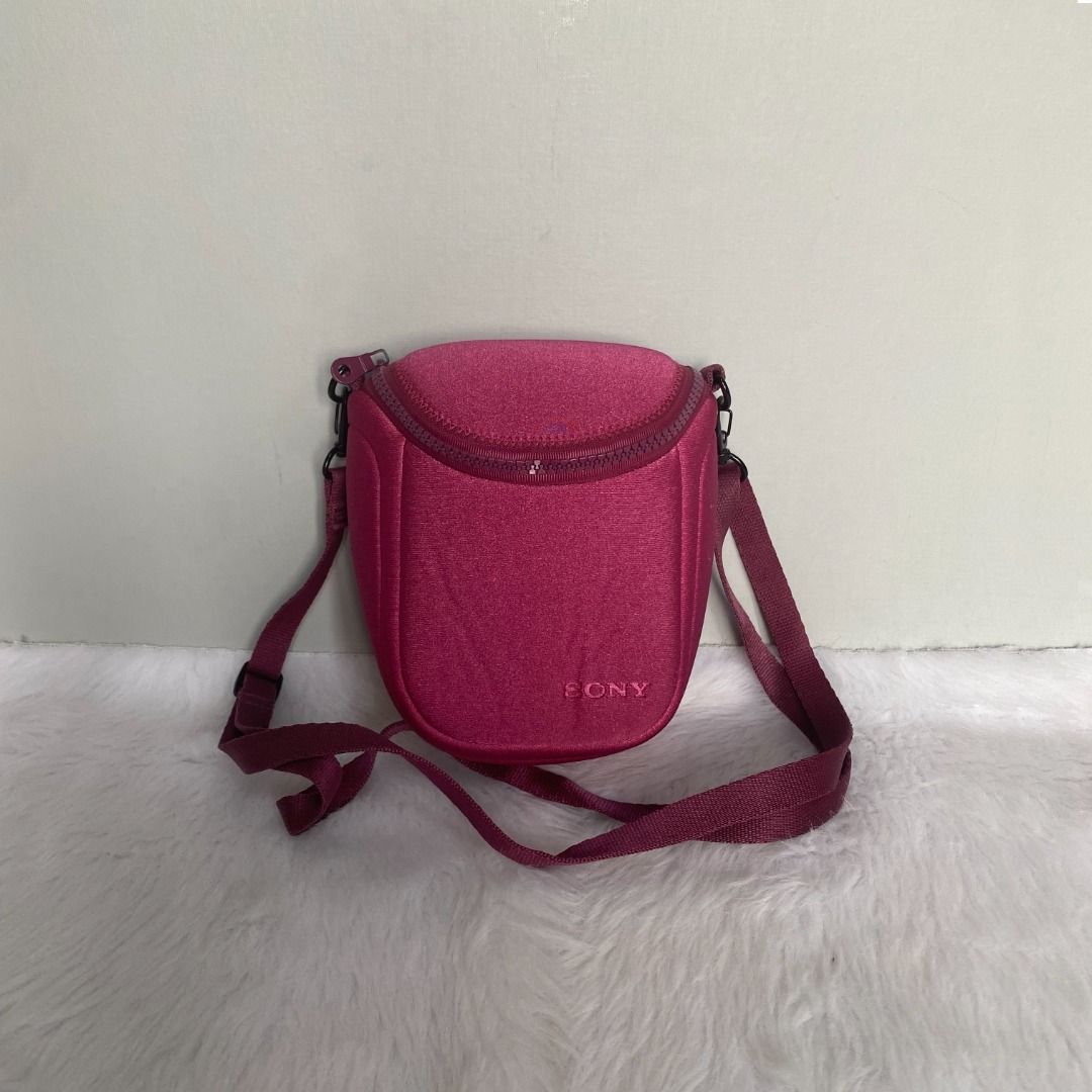 Sony Pink Crossbody Camera Bag (Category: Cross-body Bags) located in Cebu City. Submitted by posh_avenue888 (Listing ID 1336632931, Image 1). Description: In very good condition showing minimal signs of wear. 100% polyamide. 100% AUTHENTIC or your money back!!! Measurements (taken flat - approximate): Length: 5.5 inches; Height: 6 inches; Depth: 3 inches..