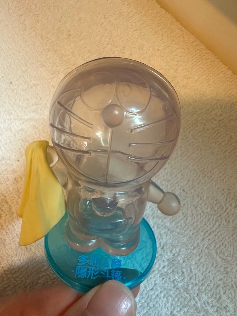 新多啦A夢透明特別版隱形斗篷擺設公仔, 興趣及遊戲, 玩具& 遊戲類- Carousell