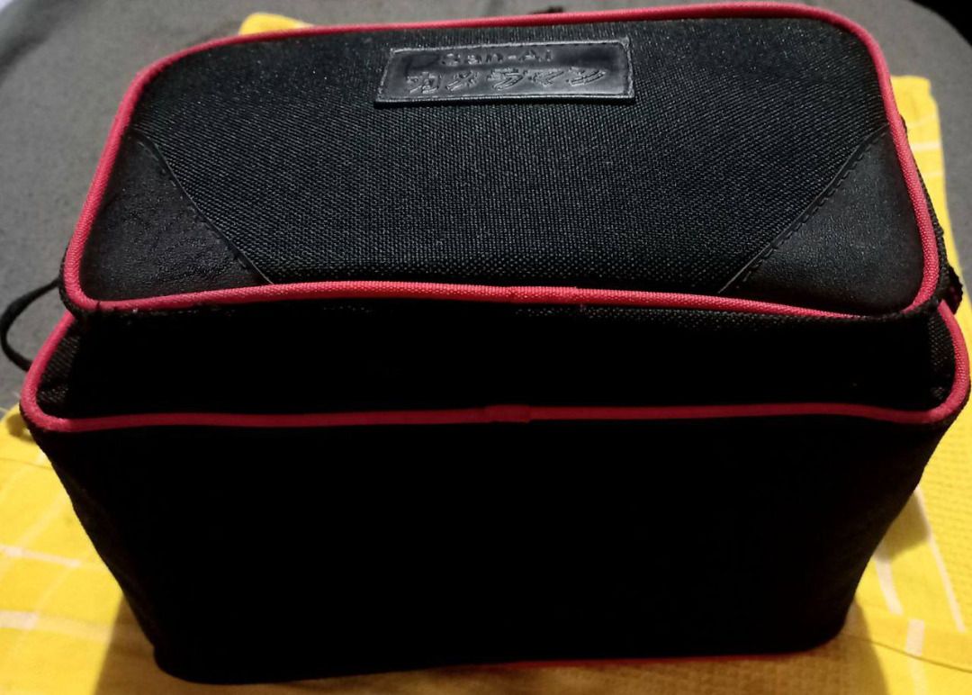 DSLR Camera Video Recorder Bag w/ Shoulder Strap (Category: Camera Bags & Carriers) located in Manila. Submitted by expatcollections (Listing ID 1336833212, Image 3). Description: CAMERA/VIDEO RECORDER bag with Adjustable Shoulder Strap Dimensions (L x W x H): 25 x 20 x 16 cms. Material & Color: Nylon Canvas Black with Red lining Brand & Condition: San-Ai Lightly used (RFS: Decluttering) .