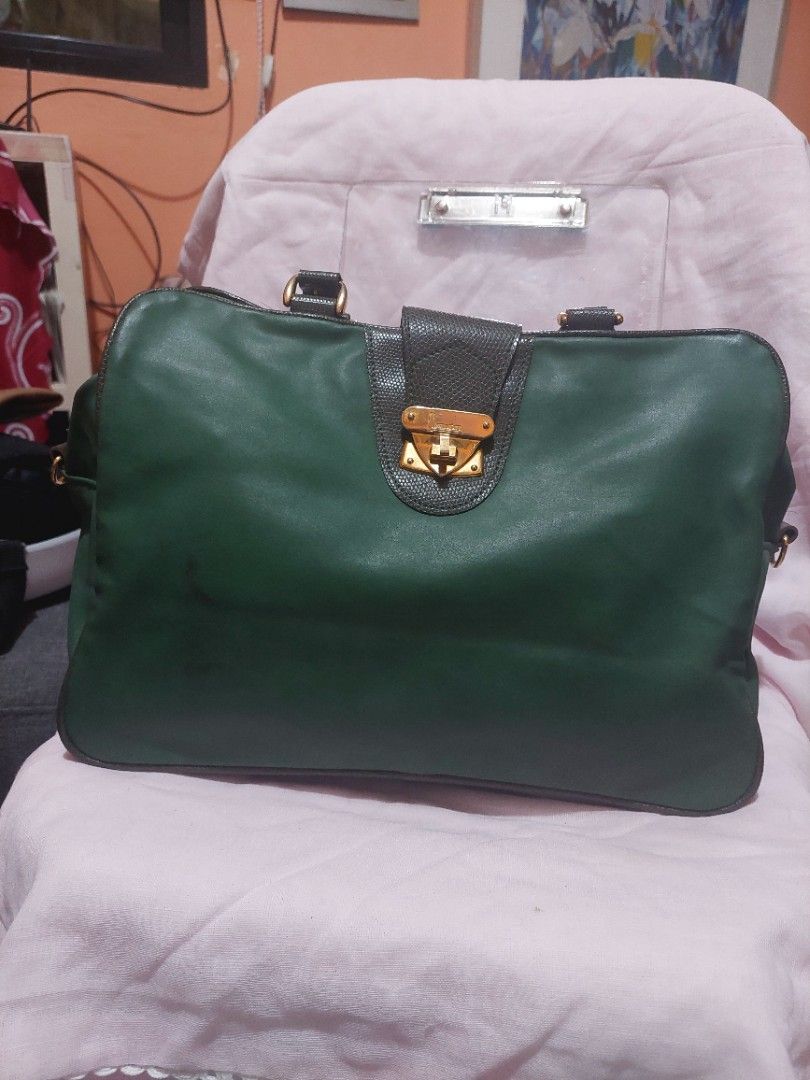 Pre-loved Green Doctor Bag from Japan (Category: Tote Bags) located in Bulacan. Submitted by ourdailyfinds (Listing ID 1336738521, Image 1). Description: 💼✨ Chic & Timeless! Pre-Loved Green Doctor Bag from Japan for Sale! ✨💼 Looking for a versatile and stylish bag? This classic doctor bag with "Immature" elegantly engraved on its gold-plated buckle closure is a perfect addition to your wardrobe. Imported from Japan, it combines elegance with pr