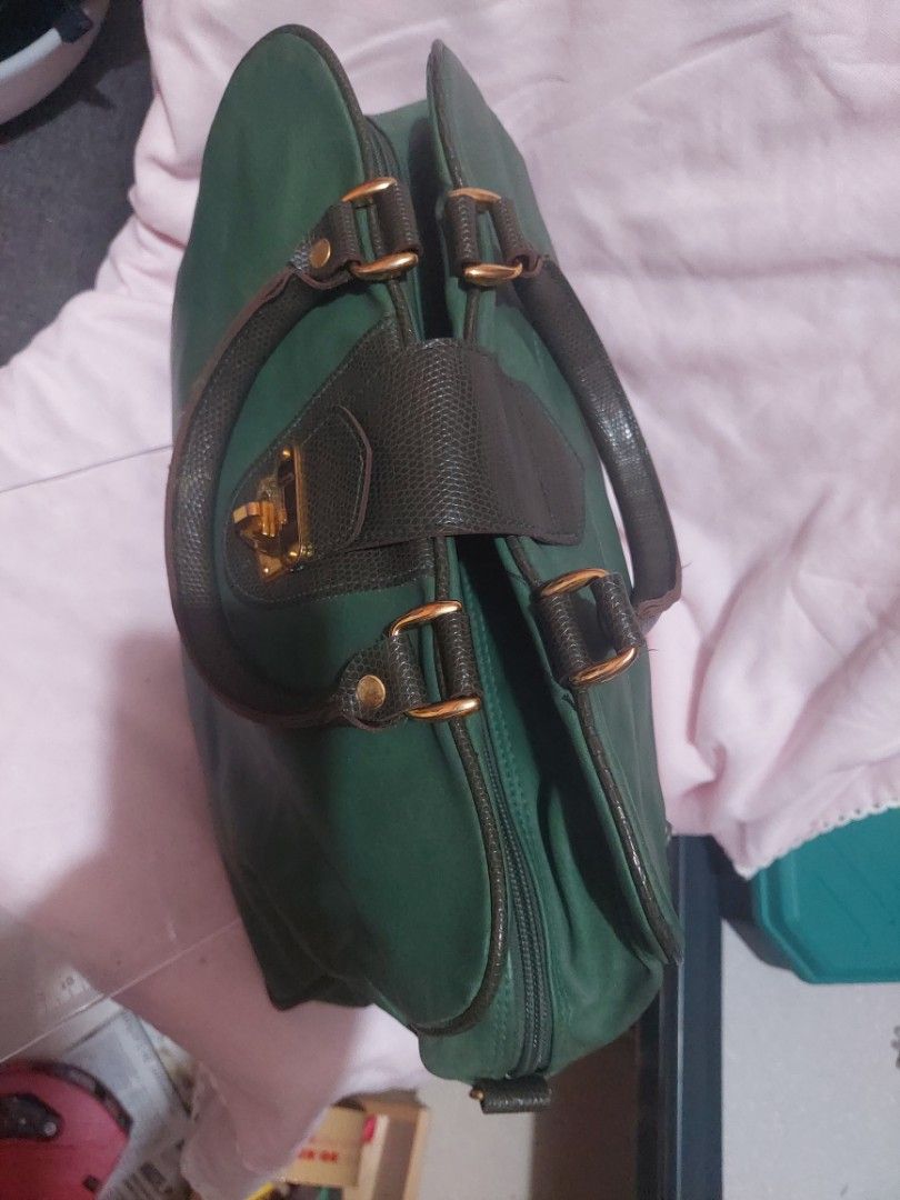 Pre-loved Green Doctor Bag from Japan (Category: Tote Bags) located in Bulacan. Submitted by ourdailyfinds (Listing ID 1336738521, Image 3). Description: 💼✨ Chic & Timeless! Pre-Loved Green Doctor Bag from Japan for Sale! ✨💼 Looking for a versatile and stylish bag? This classic doctor bag with "Immature" elegantly engraved on its gold-plated buckle closure is a perfect addition to your wardrobe. Imported from Japan, it combines elegance with pr