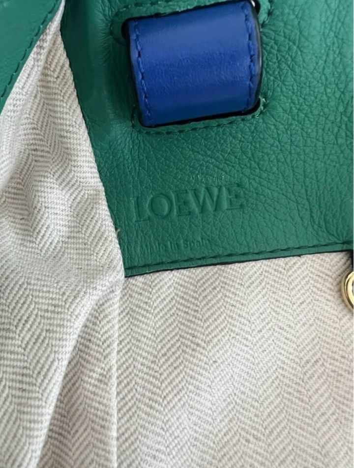 Loewe Hammock Bag - Rare Colorway First Edition (Category: Luxury Bags & Wallets) located in Makati City. Submitted by jasch21 (Listing ID 1336729400, Image 3). Description: Brand: Loewe Model: hammock leather handbag, muticolored bag, zip on sides, Packaging: With dust bag and Loewe card Size: medium Store price: P200K and up Selling price: P80K RFS: I don’t use it anymore, extra cash. Condition: Good condition though minimal scratches, polishin