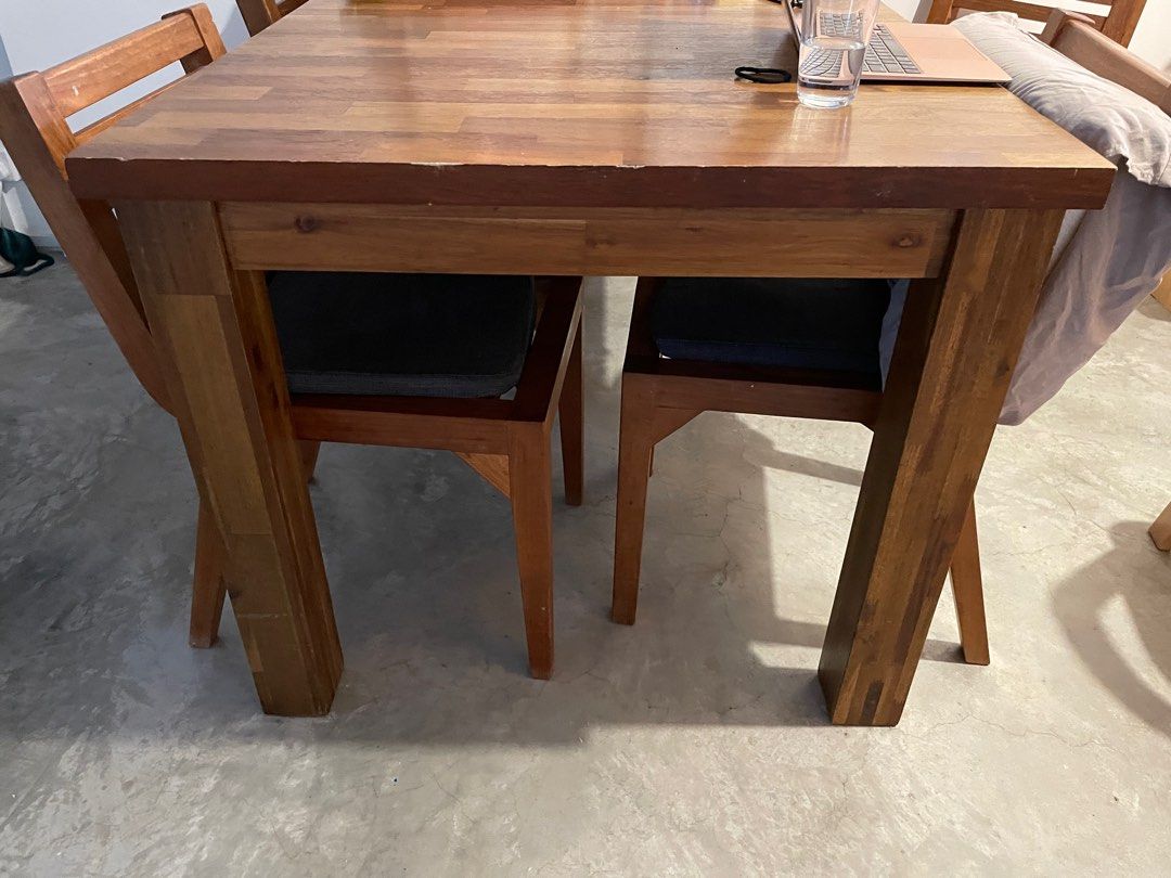 Extendable Wooden Dining Table (Category: Tables & Sets) located in Singapore. Submitted by raybear (Listing ID 1336964310, Image 1). Description: 4 seater that can be extended to 8 seater table (10 if you can put chairs at the ends) Pull the ends to fit a middle piece 4x dining chairs included Not expanded 150x90cm Expanded 200x90cm Height 77cm Condition, well used - some marks here and there. Not for fussy buyers Arrange own transport.