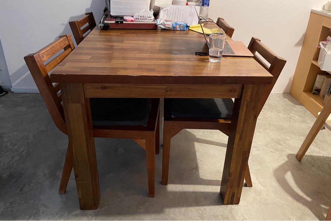 Extendable Wooden Dining Table (Category: Tables & Sets) located in Singapore. Submitted by raybear (Listing ID 1336964310, Image 3). Description: 4 seater that can be extended to 8 seater table (10 if you can put chairs at the ends) Pull the ends to fit a middle piece 4x dining chairs included Not expanded 150x90cm Expanded 200x90cm Height 77cm Condition, well used - some marks here and there. Not for fussy buyers Arrange own transport.