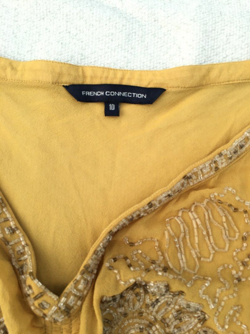 French Connection Fairy Core Embroidered Top (Category: Blouses) located in San Juan City. Submitted by poka_cutie (Listing ID 1337011966, Image 2). Description: - message for inquiries i accept offers for low price as long as its reasonable - has very minor flaw look thru pics - really cute embroidery on front is still complete .