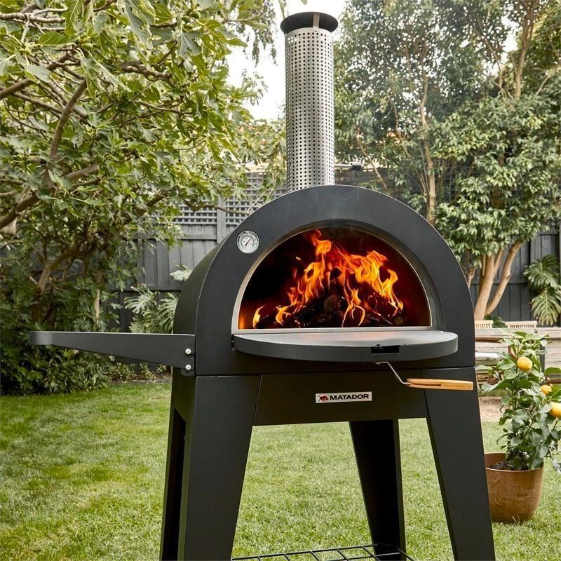 Matador Woodfired Pizza Oven (Category: Ovens & Toasters) located in Muntinlupa City. Submitted by aussie.surplustore (Listing ID 1336898066, Image 1). Description: Matador Woodfired Pizza Oven Available in 1 unit only. FEATURES: ✅ Adjustable chimney vent ✅ Trolley stand with wheels ✅ High temperature powder coated pizza oven surround and fascia ✅ Black powder coated side shelf ✅ Includes temperature gauge mounted in oven fascia Surplus from Aust