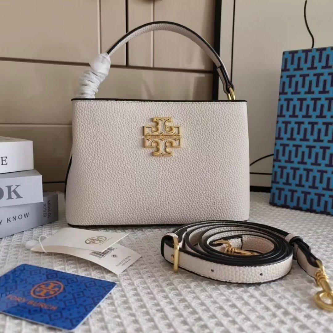 Tory Burch Britten Micro Satchel Bag (White) (Category: Luxury Bags & Wallets) located in Cebu City. Submitted by s_415 (Listing ID 1336921266, Image 1). Description: Tory Burch Britten Micro Satchel Bag (White) - Color: White - Brand New, Never Used - Comes with Dust bag and box.
