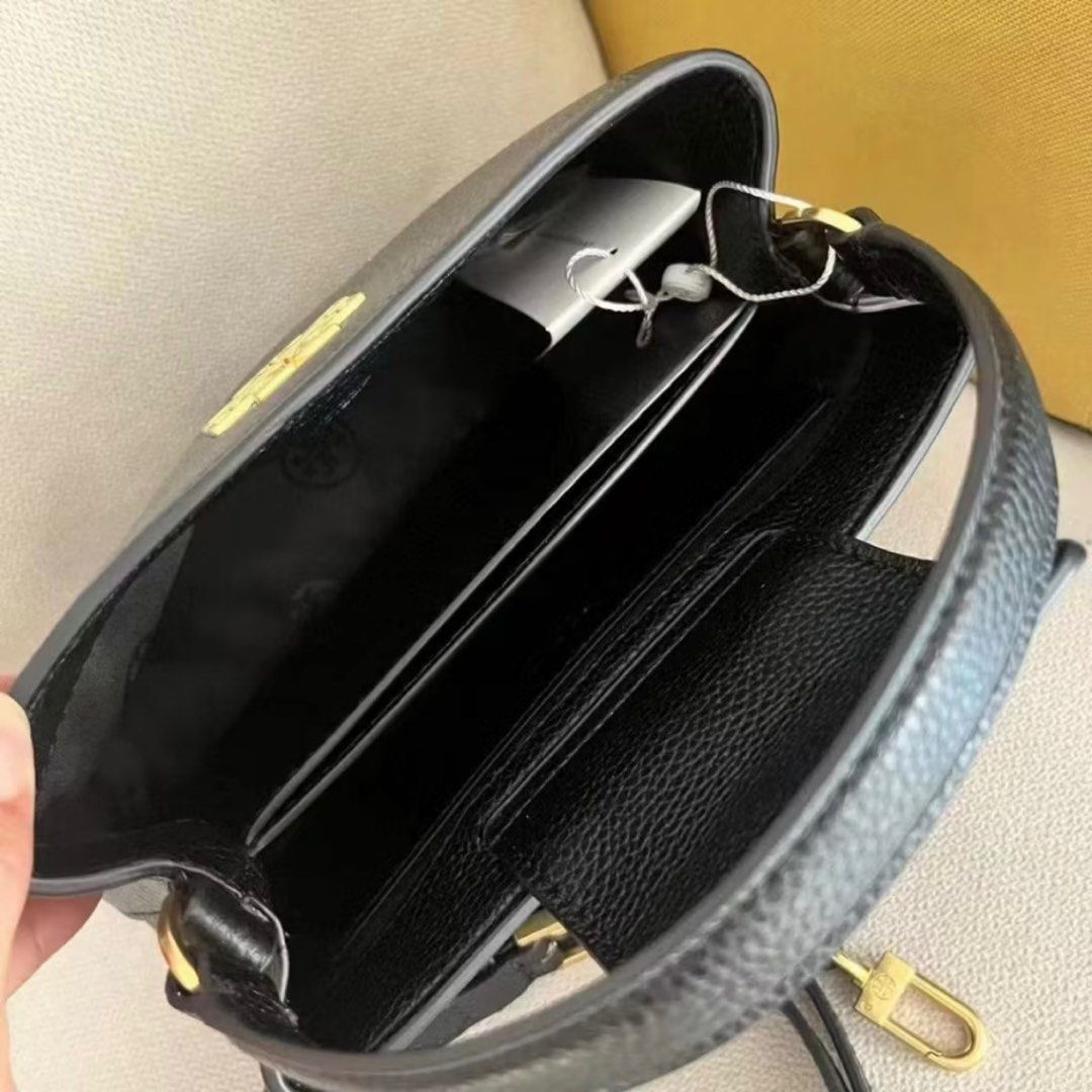 Tory Burch Britten Micro Satchel Bag (White) (Category: Luxury Bags & Wallets) located in Cebu City. Submitted by s_415 (Listing ID 1336921266, Image 3). Description: Tory Burch Britten Micro Satchel Bag (White) - Color: White - Brand New, Never Used - Comes with Dust bag and box.