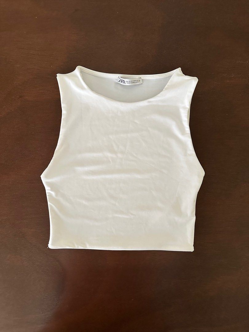 Zara Sleeveless Crop Top (Category: Sleeveless) located in Paranaque City. Submitted by mpang_ (Listing ID 1336894198, Image 2). Description: Zara Polyamide Crop Top in White Size S (see last pic for size chart). Cropped mid-ribcage fit. Stretchy, non-sheer, and flattering fabric without being too revealing on the sides. Perfect for petite girls 🎀 Worn once, like new. RFS: Decluttering.